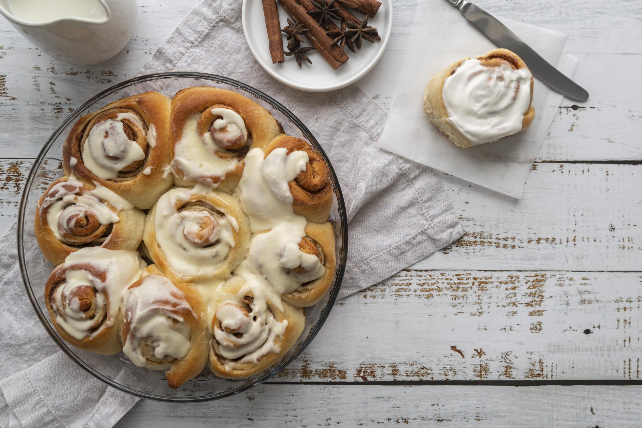 Golden brown sourdough cinnamon rolls recipe with a glossy cream cheese glaze, fresh out of the oven.