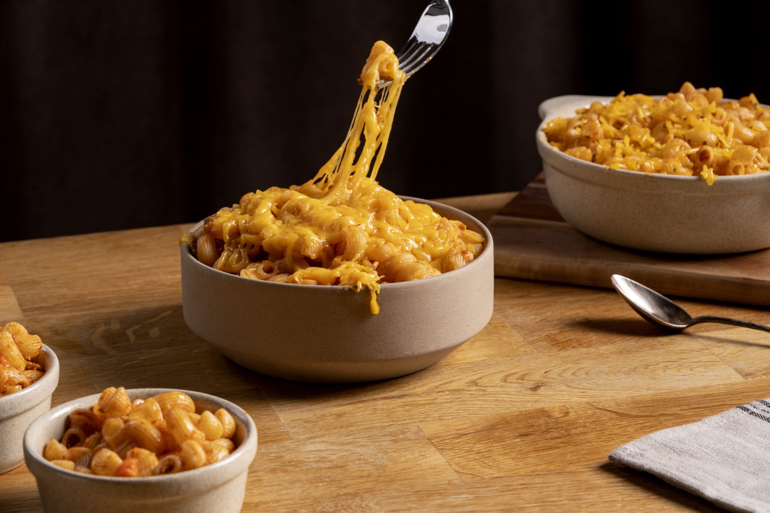 Close-up of creamy smoked mac and cheese in a cast-iron skillet, topped with golden breadcrumbs.