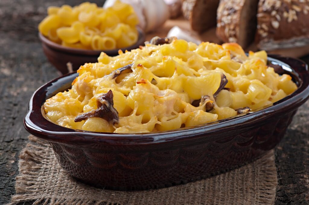 Smoked mac and cheese fresh out of the smoker, with a crispy, cheesy crust.